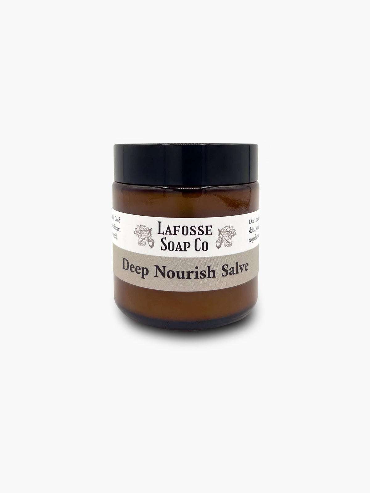 Deep Nourish Salve jar surrounded by natural organic ingredients for skin hydration and soothing