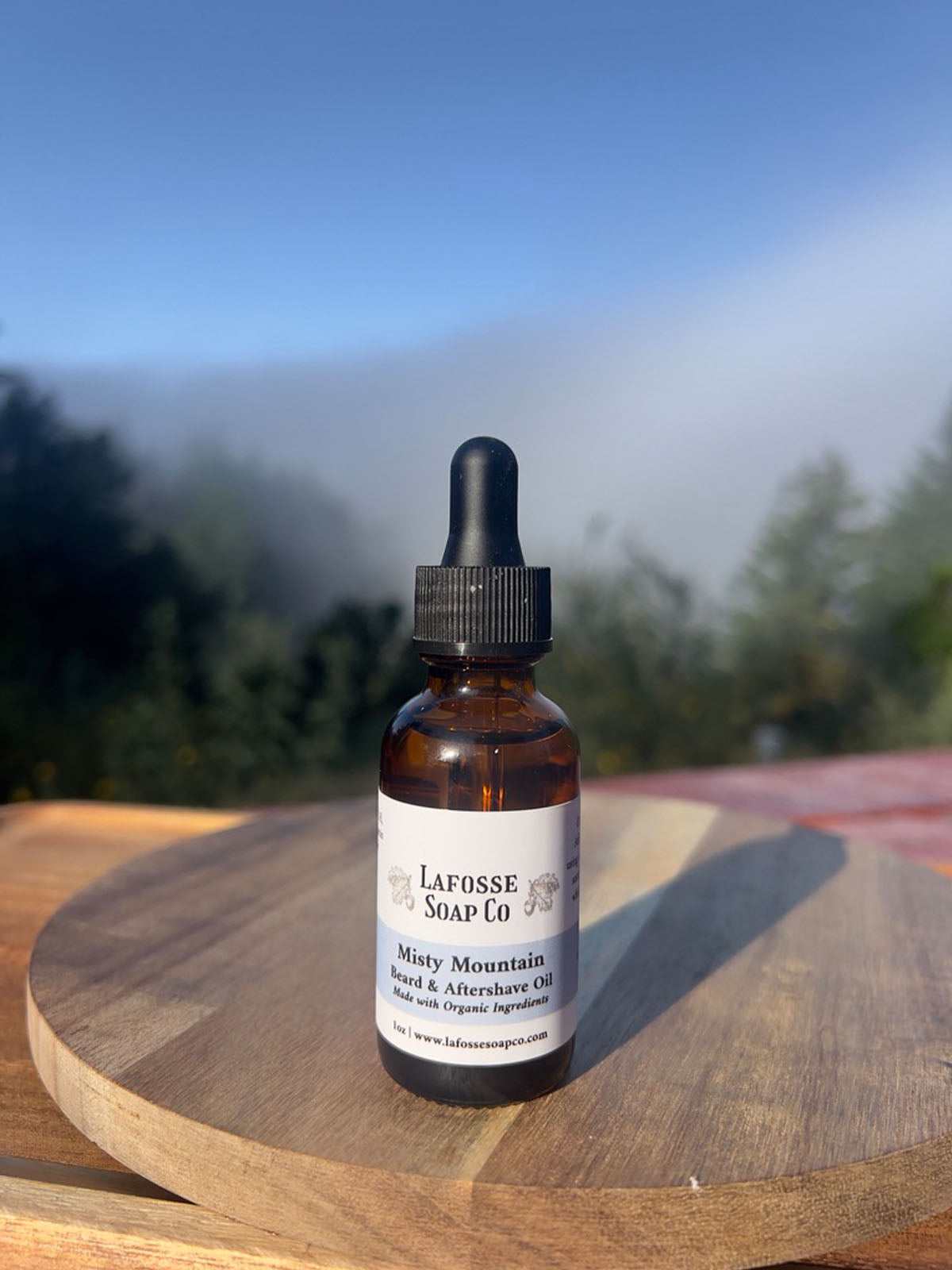 Bottle of Misty Mountain Beard & Aftershave Oil with natural ingredients for hydration and soothing post-shave care