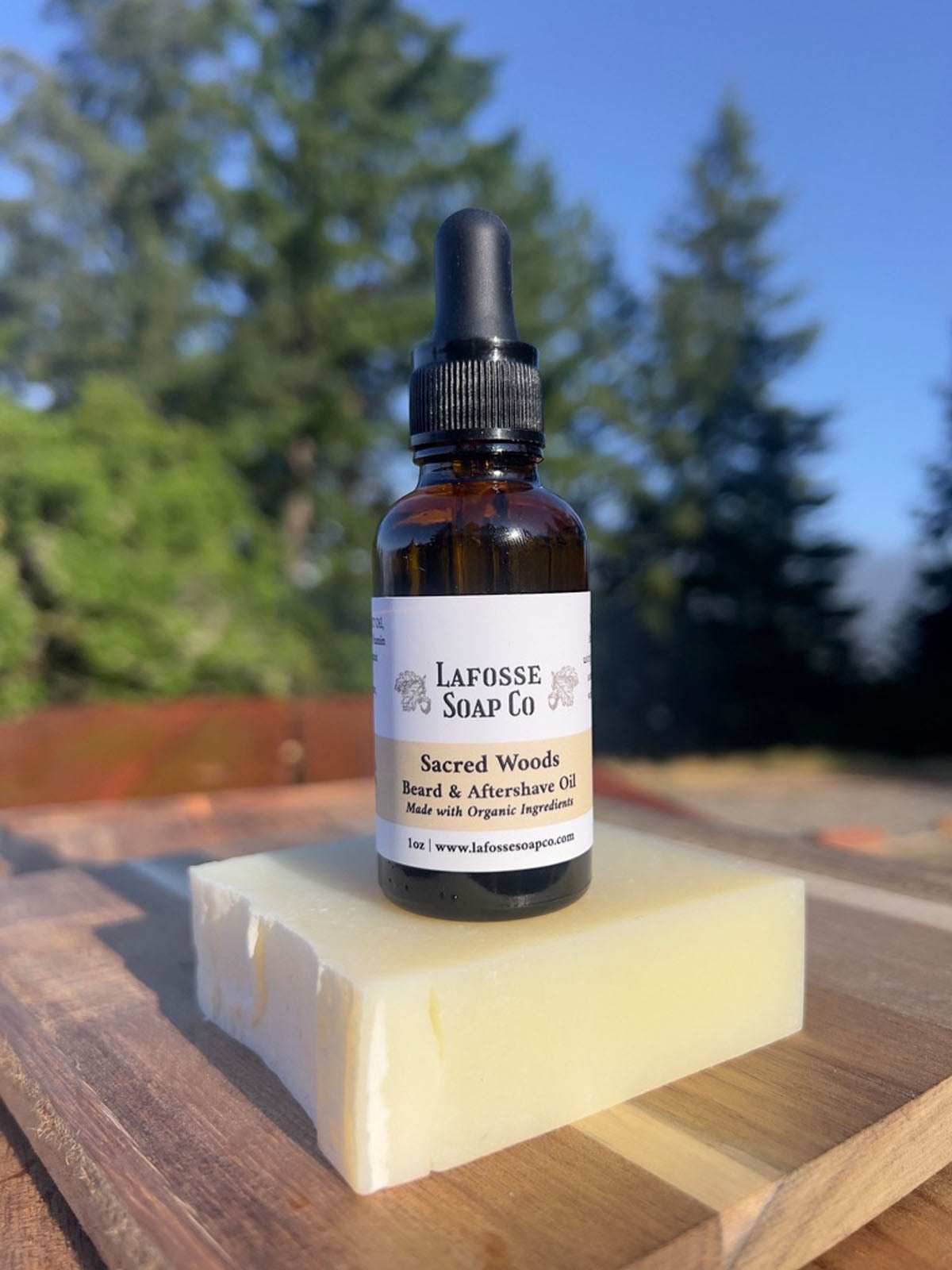 Sacred Woods Beard & Aftershave Oil bottle with natural ingredients background